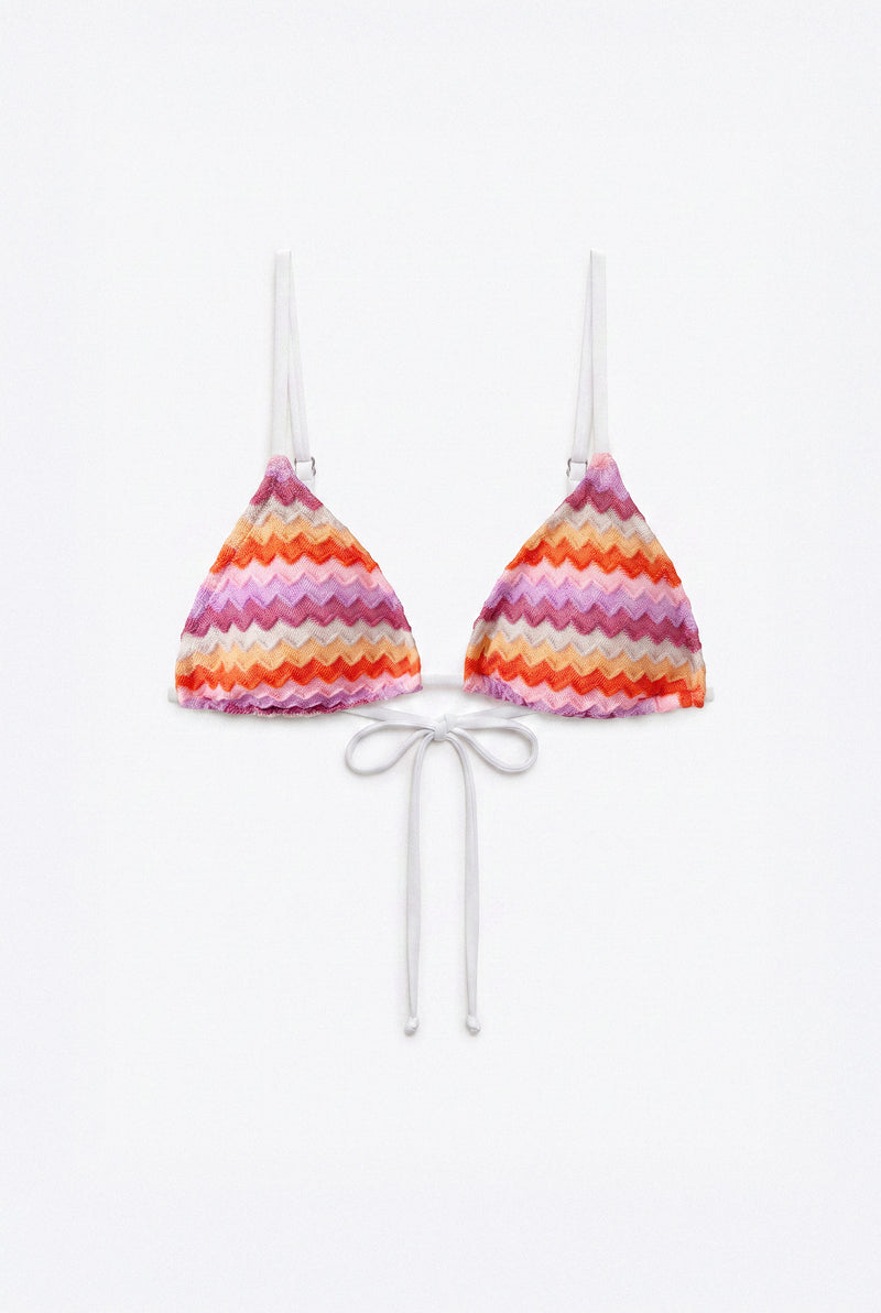 A two-piece triangle bikini set with a vibrant chevron pattern in pink, orange, purple, and white, featuring white strings and thin shoulder straps, displayed on a clean white background.
